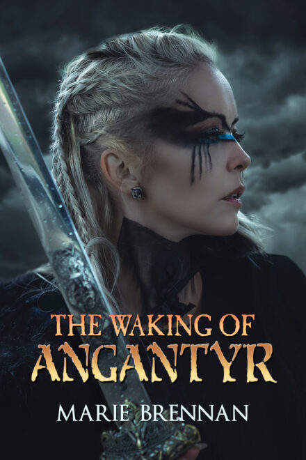 cover art for THE WAKING OF ANGANTYR by Marie Brennan, showing a white woman with braided blonde hair and wing-like black paint around her eyes, holding a sword and looking to her left