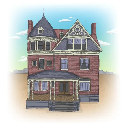 A red-brick house in a Victorian style sits in the middle of a desert